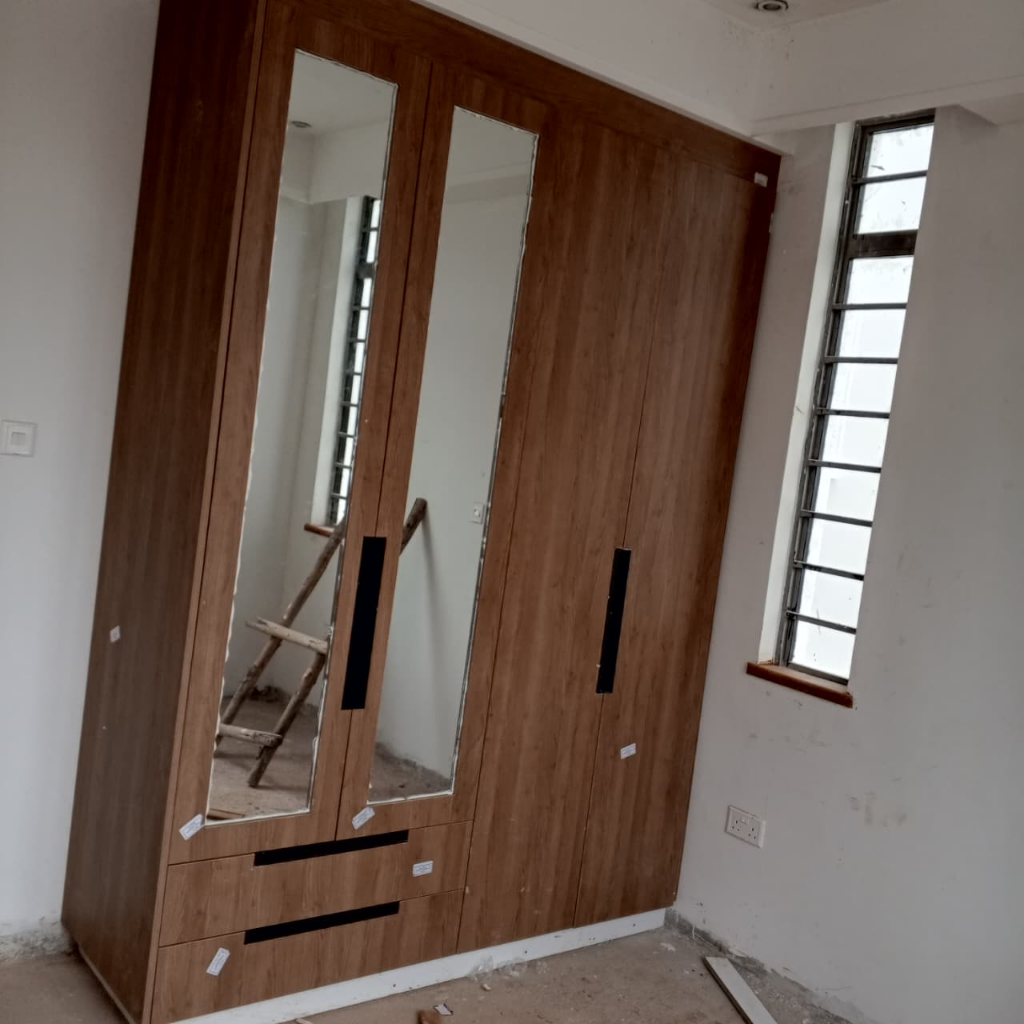 Bespoke Fitted Mirrored Wardrobe in Natural Oak - Residential interior fit-out in Nairobi, Kenya by BenPhil Interiors