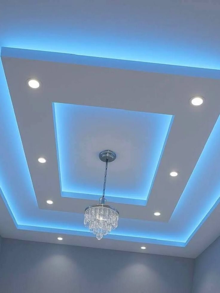 Simple modern gypsum ceiling design with recessed lighting in a small apartment living room